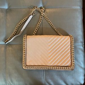 Nude purse with gold chain detail